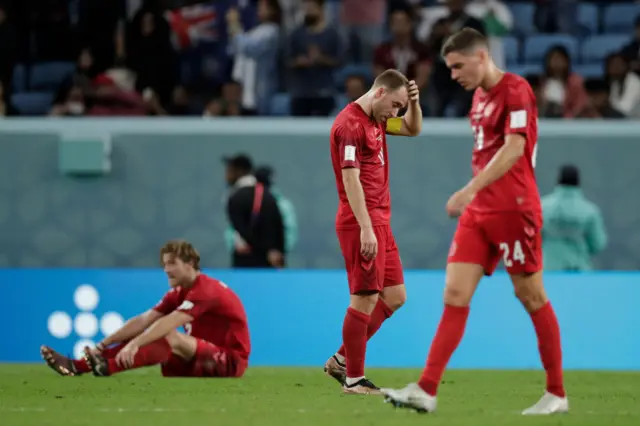 Denmark players look dejected after losing to Australia