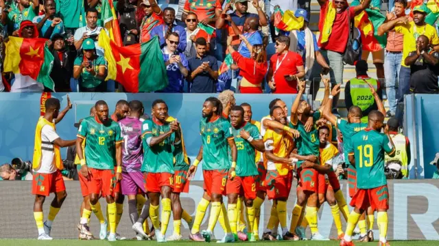 Cameroon celebrate against Serbia