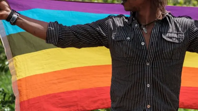 Man in Kenya with Pride flag