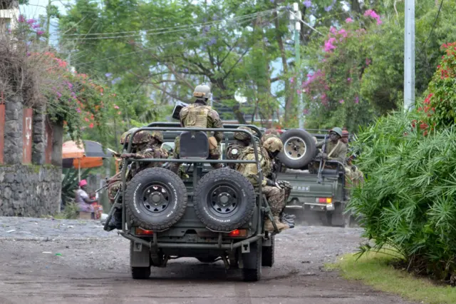 Military troops are seen after a military plane, carrying Military troops sent by Kenya to the eastern Democratic Republic of the Congo