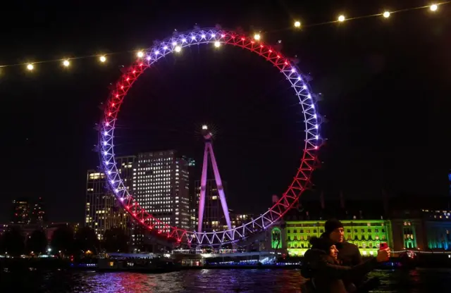 The London Eye lit up in red and white