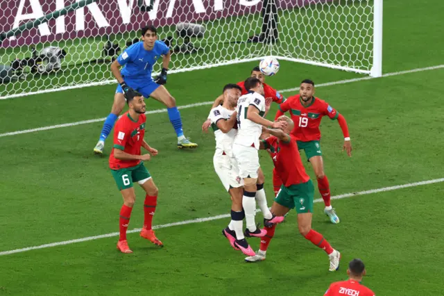 Ruben Dias of Portugal heads the ball