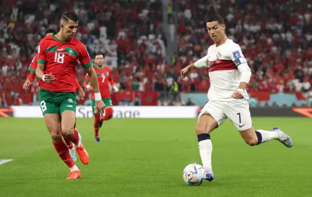 Cristiano Ronaldo of Portugal shoots past Jawad El Yamiq