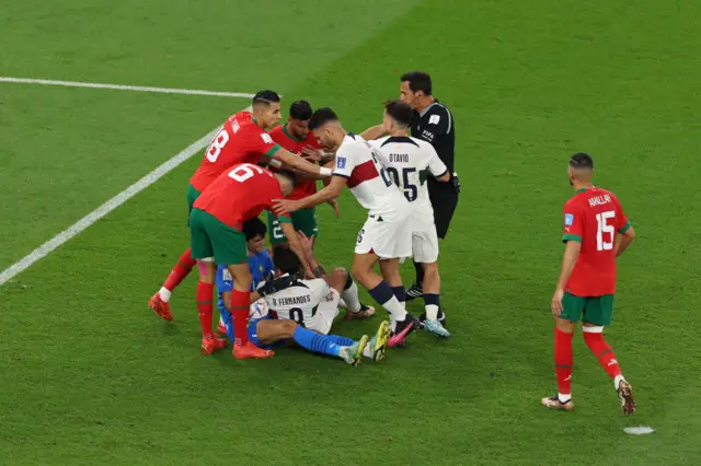 Yassine Bounou of Morocco and Bruno Fernandes of Portugal