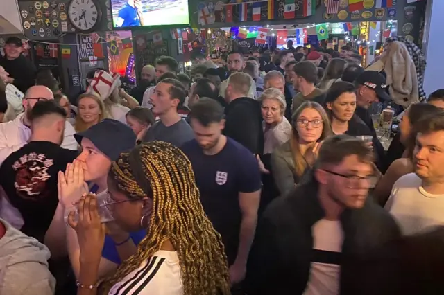 A group of England fans in a pub