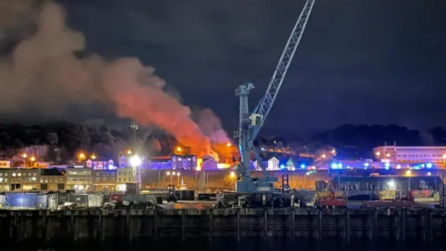 A large red fire coming out of a building at St Helier in Jersey