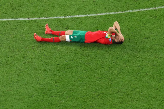 Romain Saiss of Morocco lies on the pitch