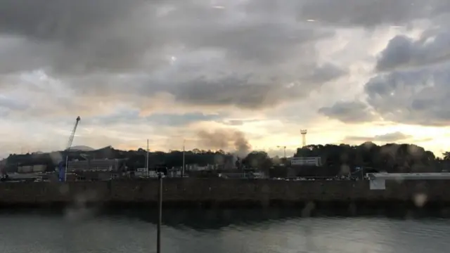 A thick smoke coming from the scene of the explosion