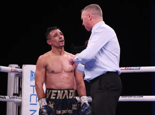 Luis Alberto Lopez speaks with referee Bob Williams