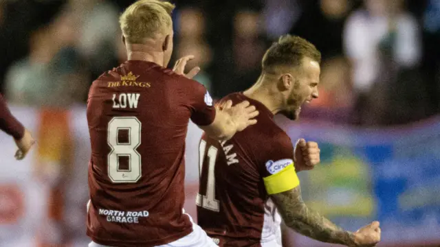 Kelty's Kallum Higginbotham (right) celebrates