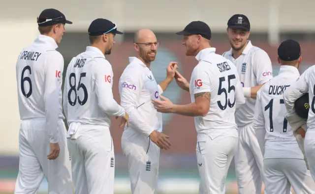 Jack Leach of England is congratulated on the wicket of Saud Shakeel of Pakistan during day two of the Second Test Match between Pakistan and England at Multan Cricket Stadium on December 10, 2022 in Multan, Pakistan