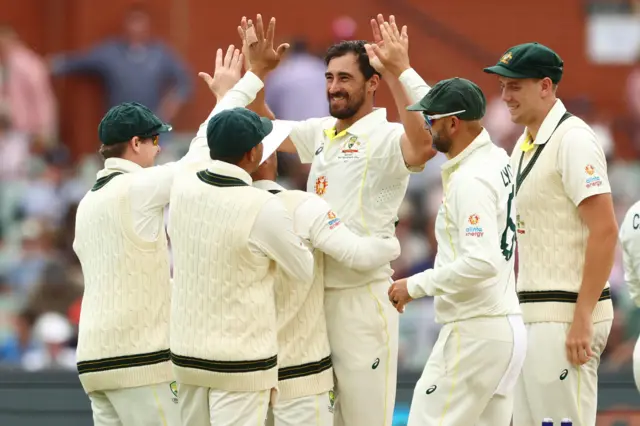 Australia celebrating a Mitchell Starc wicket