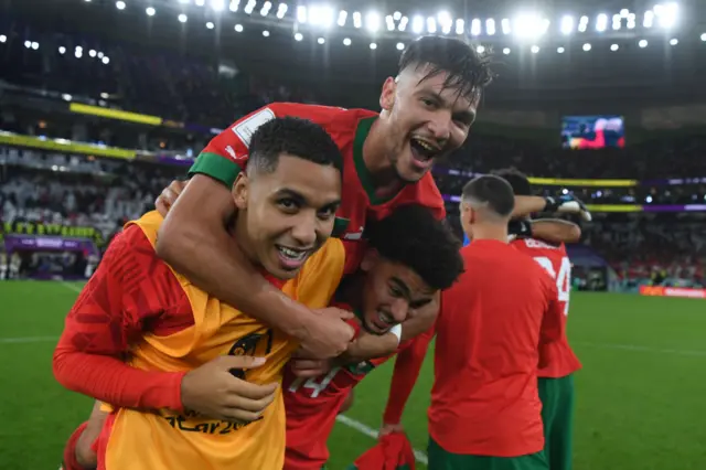 Abdelhamid Sabiri (L), Achraf Dari and Zakaria Aboukhlal of Morocco celebrate