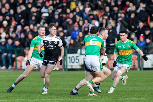 Kilcoo's Anthony Morgan is tackled by Michael Warnock