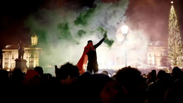 Morocco fans with flares celebrate after reaching the semi final in London, UK, on 10 December 2022