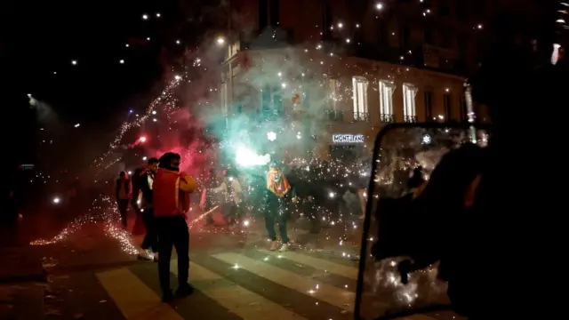 Morocco fans celebrate with flares in Paris, France, on 10 December 2022