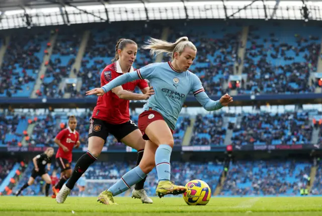 Lauren Hemp of Manchester City battles for possession with Ona BatlleLauren Hemp of Manchester City battles for possession with Ona Batlle