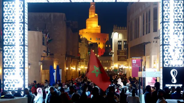 Morocco fans in Souq Waqif celebrate as Morocco progress to semi-finals of the World Cup in Doha, Qatar