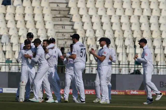 England celebrating a wicket