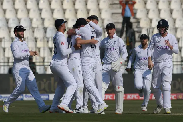 England celebrating a wicket