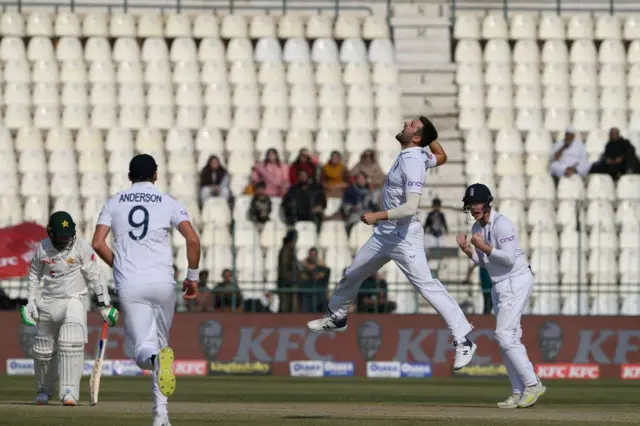 England celebrating Mark Wood's wicket