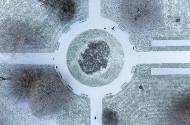 People walk in the gardens of St Nicholas' Park in Warwick