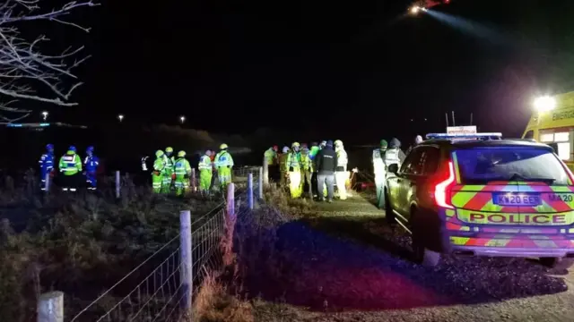 Emergency services and volunteers at the Siddick Ponds area of Workington, Cumbira, on Sunday