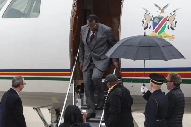 Namibian President Hage Gottfried Geingob, (C) arrives at Joint Base Andrews in Maryland on December 11, 2022