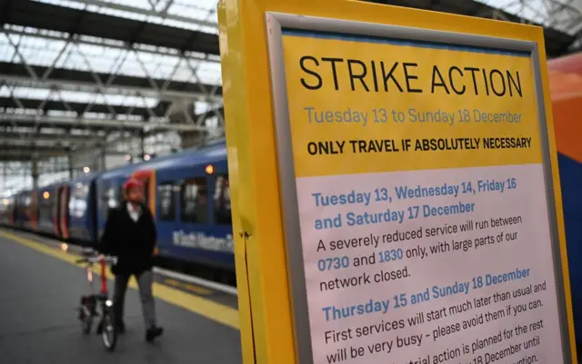 A sign detailing strike action at Waterloo Station, London