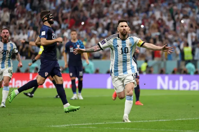 Lionel Messi celebrates scoring for Argentina