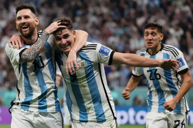 Lionel Messi celebrate with Julian Alvarez