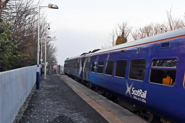 A ScotRail train at a station platform