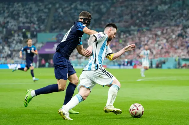 Lionel Messi right winger of Argentina and Paris Saint-Germain and Josko Gvardiol centre-back of Croatia and RB Leipzig compete for the ball during the FIFA World Cup Qatar 2022 semi final match between Argentina and Croatia