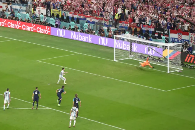 Lionel Messi scores a penalty for Argentina