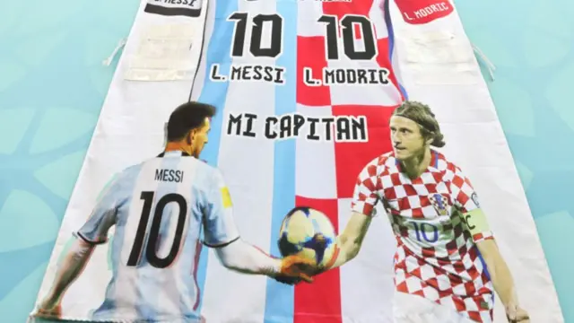 Banner showing Lionel Messi and Luka Modric