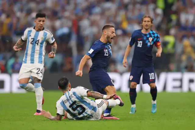 Leandro Paredes makes a tackle