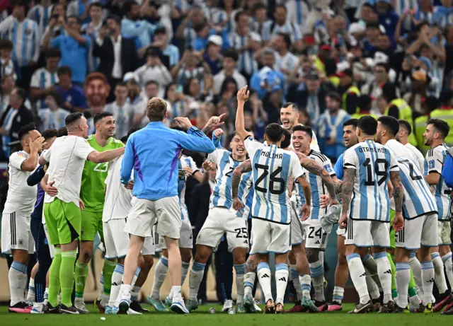 Argentina's players celebrate reaching the 2022 World Cup after a 3-0 victory over Croatia