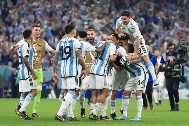 Argentina's players celebrate at full-time in their semi-final after beating Croatia 3-0