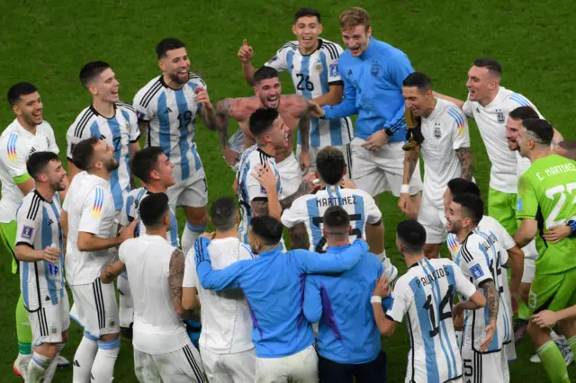 Argentina's players celebrate reaching the 2022 World Cup final with a 3-0 win over Croatia