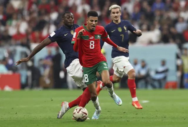 Azzedine Ounahi of Morocco vies with Youssouf Fofana of France during the FIFA World Cup Qatar 2022 semi final match between France and Morocco at Al Bayt Stadium