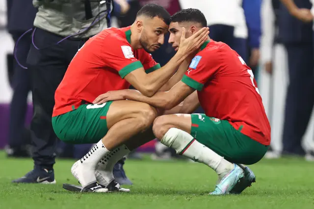 A dejected Romain Saiss and Achraf Hakimi of Morocco after losing 2-0 and being knocked out of the tournament during the FIFA World Cup Qatar 2022 semi final match between France and Morocco at Al Bayt Stadium