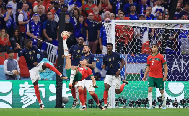 Jawad El Yamiq of Morocco shoots acrobatically with an overhead kick during the FIFA World Cup Qatar 2022 semi final match between France and Morocco at Al Bayt Stadium