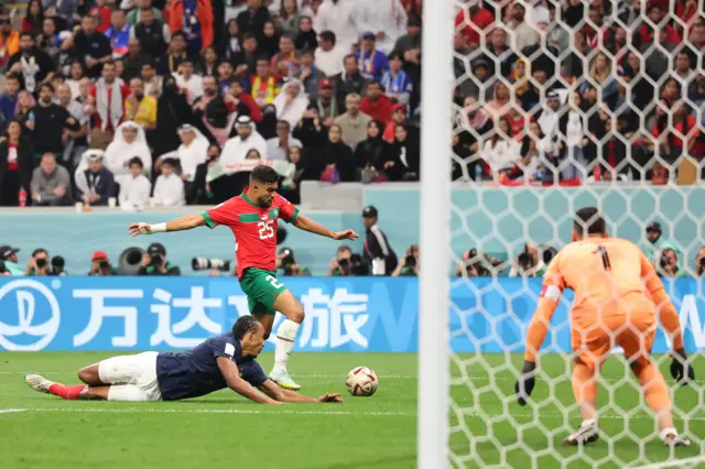 Jules Kounde of France looks on as Yahia Attiyat Allah of Morocco fails to capitalise on a chance to score during the FIFA World Cup Qatar 2022 semi final match between France and Morocco at Al Bayt Stadium