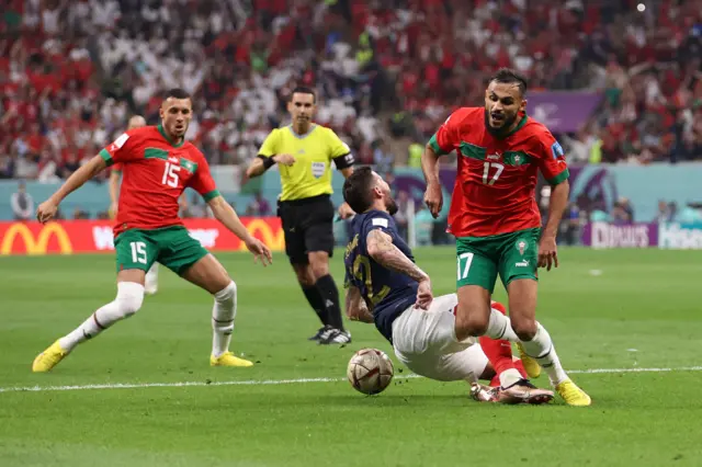 Theo Hernandez of France is fouled by Sofiane Boufal of Morocco during the FIFA World Cup Qatar 2022 semi final match between France and Morocco at Al Bayt Stadium