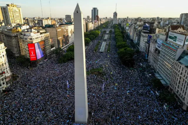 Crowds gather around the Buenos Aires monument in Argentina