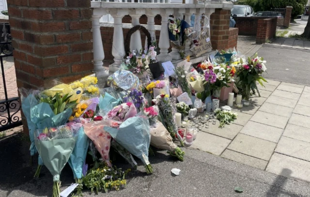 Crime scene on Cranbrook Road where floral tributes have been laid