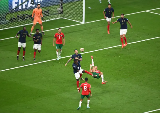 Jawad El Yamiq of Morocco shoots acrobatically with an overhead kick during the FIFA World Cup Qatar 2022 semi final match between France and Morocco at Al Bayt Stadium