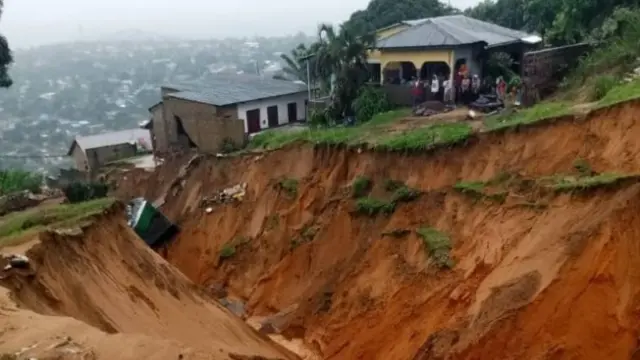 A view of the collapsed road due to the landslide after heavy rain cause flood in Kinsasha