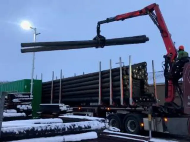 Electricity poles being unloaded at Lerwick Power Station