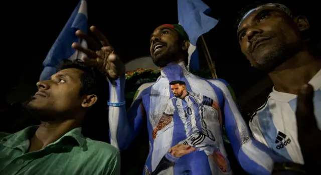 A Bangladeshi Argentina fan sports a Lionel Messi mural on his chest